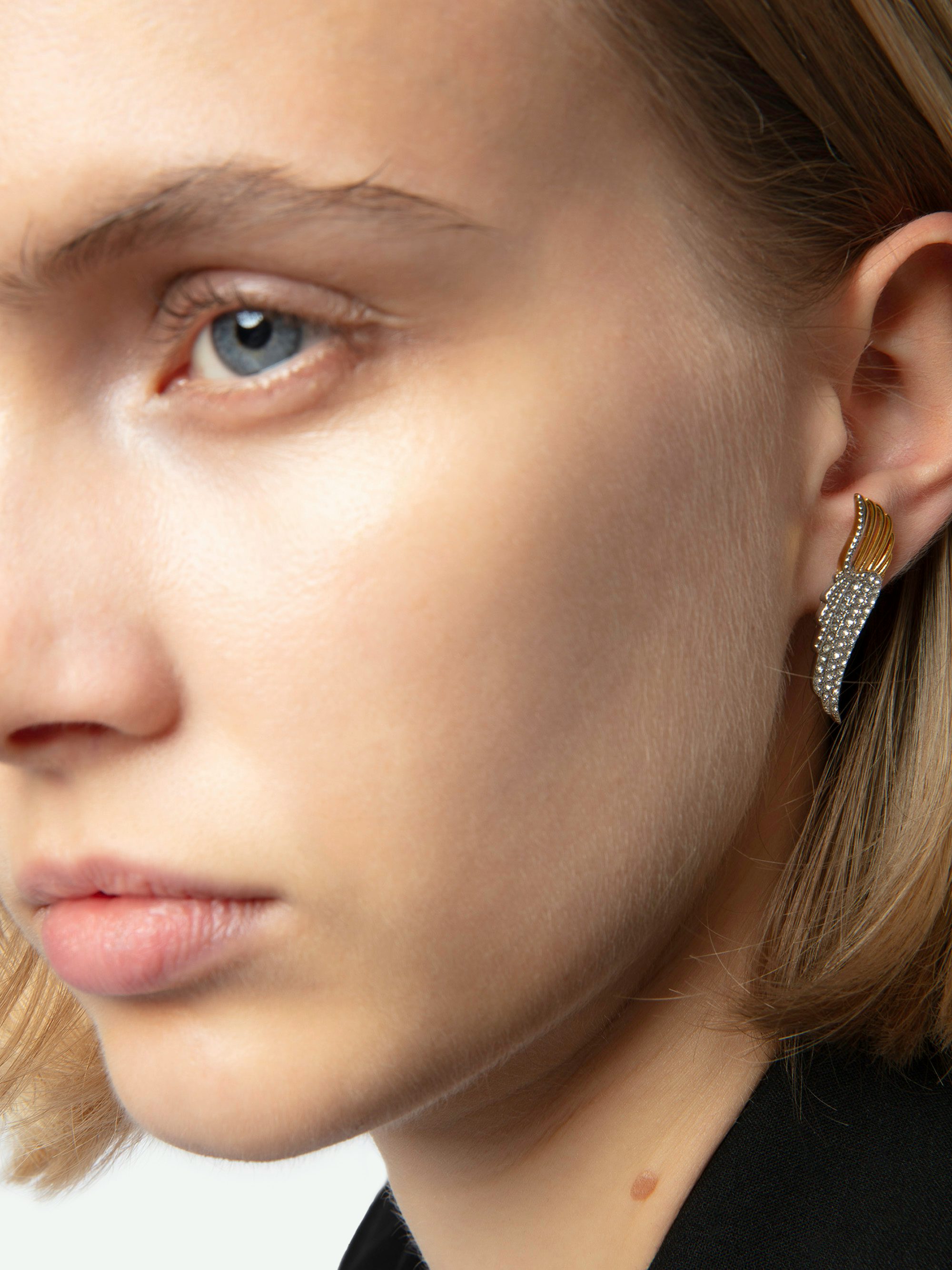 Rock Over Earrings - Wing-shaped earrings in gold-toned metal set with rhinestones.